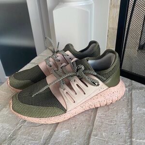 Custom Adidas Tubular Radial sneakers in an olive green and blush pink colorway